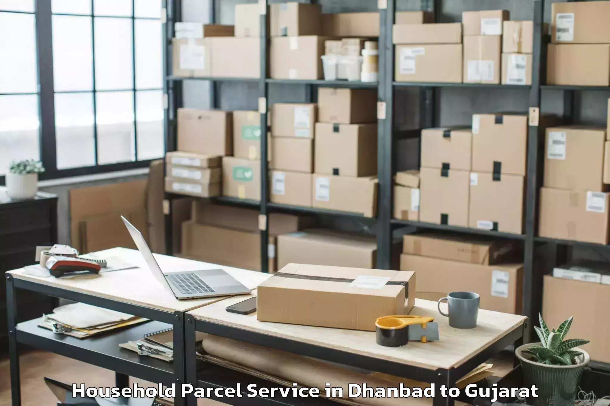 Book Dhanbad to Gussar Household Parcel